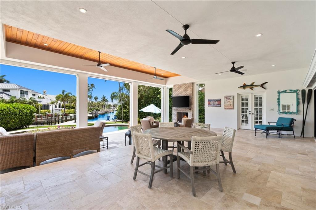 2201 Beacon Lane Naples, FL 34103 - Photo 5 of 25 a view of a dining room with furniture window and outside view