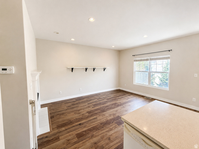 14767 Invergarry Court Draper, UT 84020 - Photo 3 of 18 Spacious room featuring wood-finish flooring, recessed lighting, and a prominent window