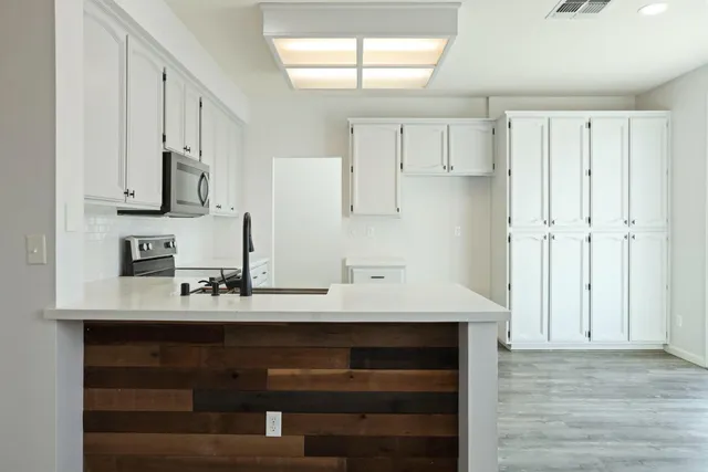 a view of kitchen with wooden floor
