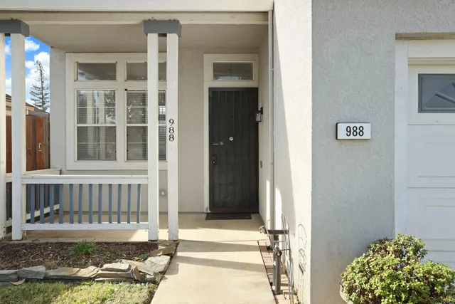a view of porch with a bench and floor to ceiling window