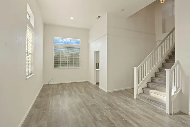 a view of an entryway with wooden floor
