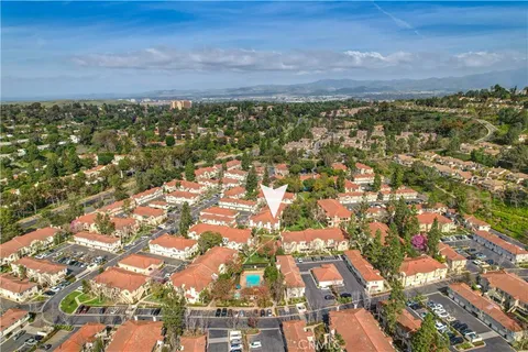 an aerial view of residential building and green space