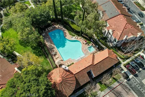 an aerial view of a house with a yard