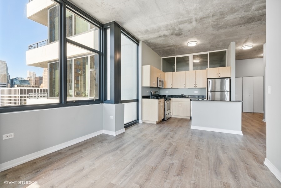 235 West Van Buren Street, Unit 3314 Chicago, IL 60607 - Photo 11 of 29 a view of kitchen with stainless steel appliances granite countertop a stove and a wooden floors
