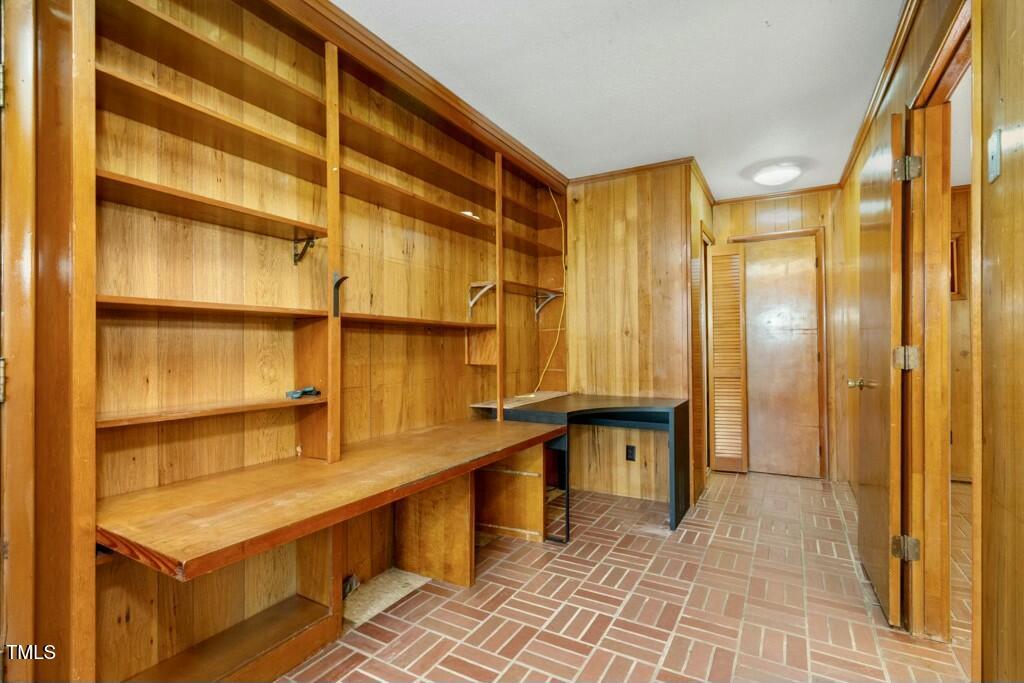 3237 Birnamwood Road Raleigh, NC 27607 - Photo 20 of 32 a view of a bathroom with a sink and a mirror