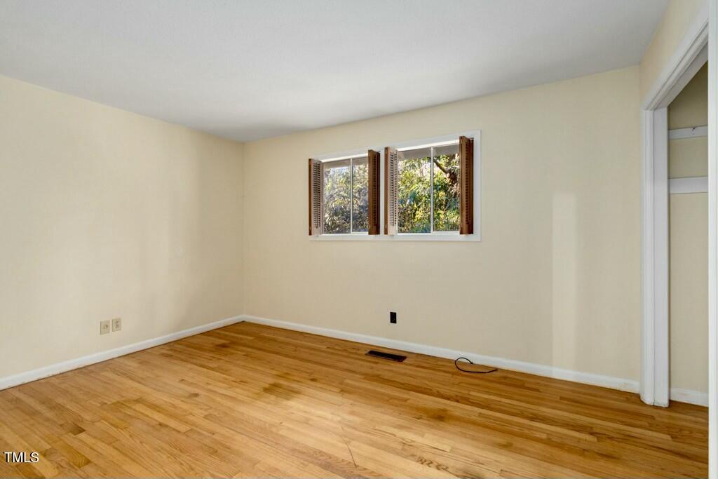 3237 Birnamwood Road Raleigh, NC 27607 - Photo 21 of 32 a view of empty room with wooden floor
