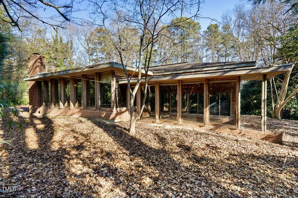 3237 Birnamwood Road Raleigh, NC 27607 - Photo 4 of 32 a front view of a house with a garden