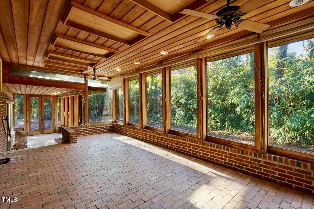 3237 Birnamwood Road Raleigh, NC 27607 - Photo 5 of 32 a view of a room with wooden floor and windows