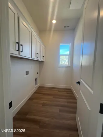 a view of room with window and hardwood floor