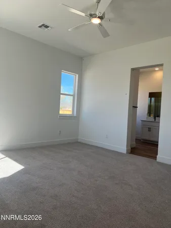 an empty room with a bathroom