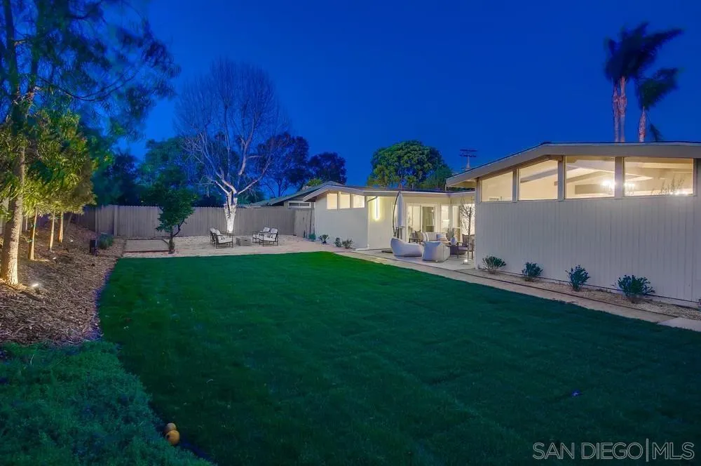 5878 Soledad Road La Jolla, CA 92037 - Photo 12 of 74 a backyard of a house with table and chairs