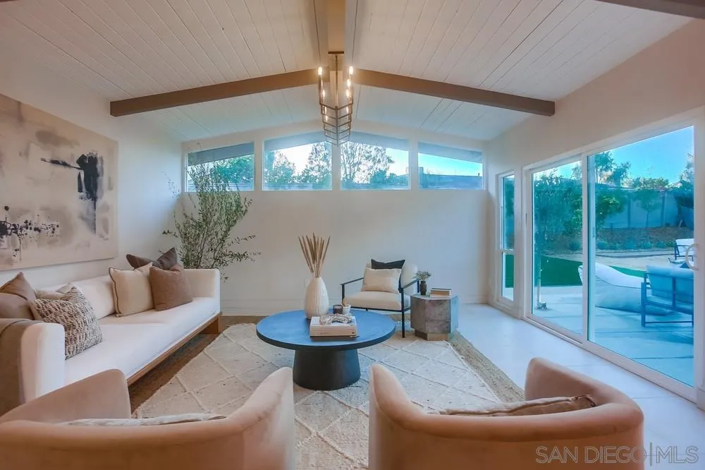 5878 Soledad Road La Jolla, CA 92037 - Photo 20 of 74 a living room with furniture and a chandelier