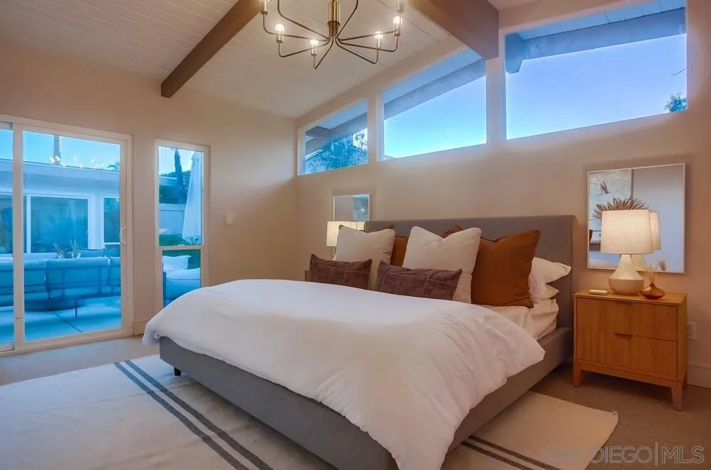 5878 Soledad Road La Jolla, CA 92037 - Photo 27 of 74 a bedroom with bed and window
