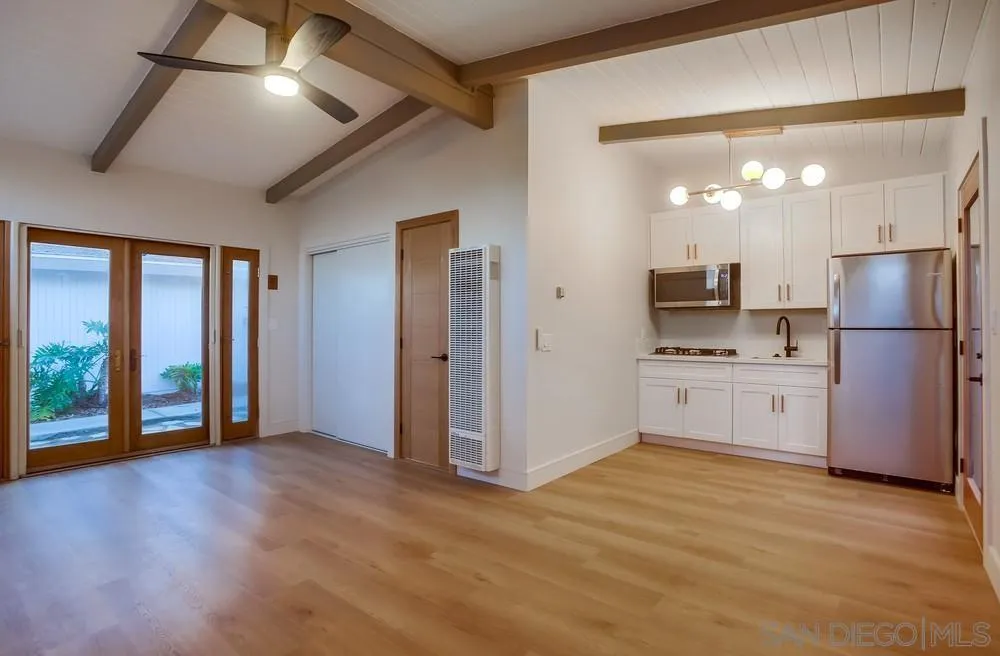 5878 Soledad Road La Jolla, CA 92037 - Photo 47 of 74 a kitchen with a refrigerator and a sink