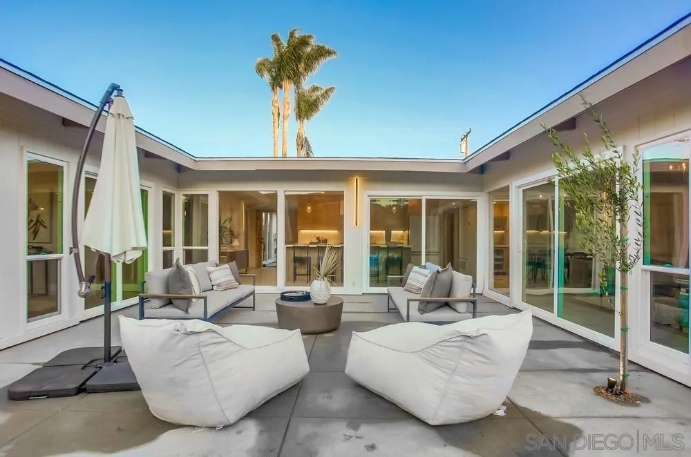 5878 Soledad Road La Jolla, CA 92037 - Photo 63 of 74 a living room with patio furniture and a potted plant