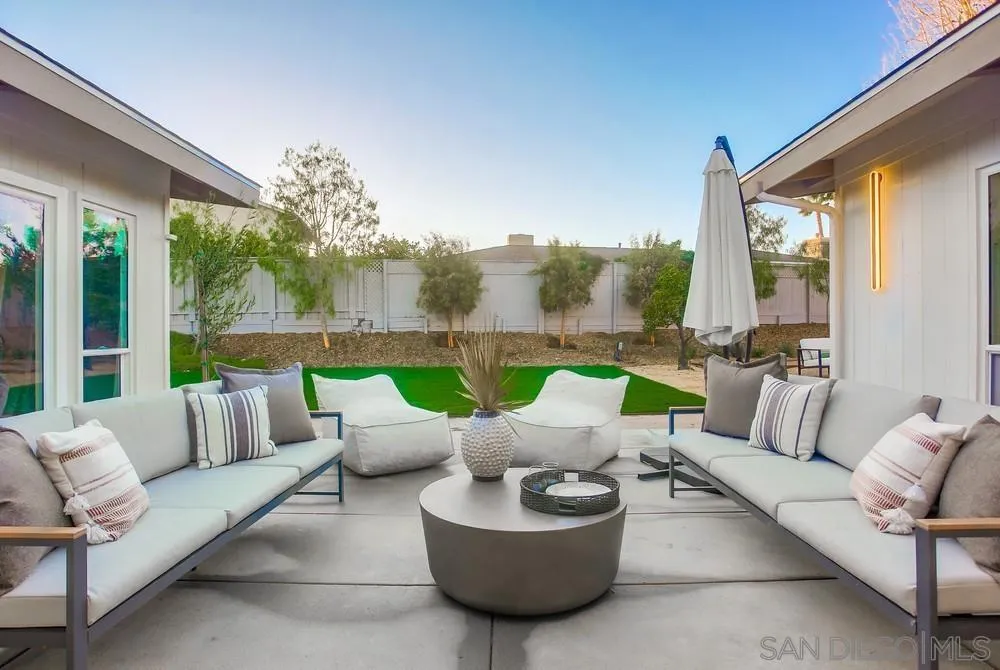 5878 Soledad Road La Jolla, CA 92037 - Photo 66 of 74 a balcony with furniture and a garden