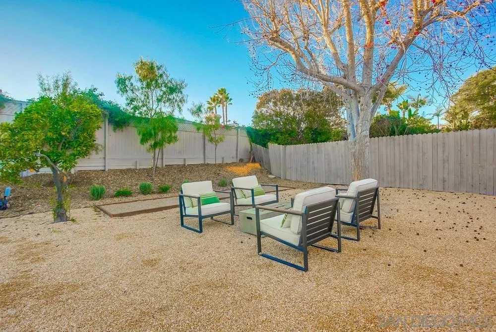 5878 Soledad Road La Jolla, CA 92037 - Photo 74 of 74 a backyard of a house with table and chairs