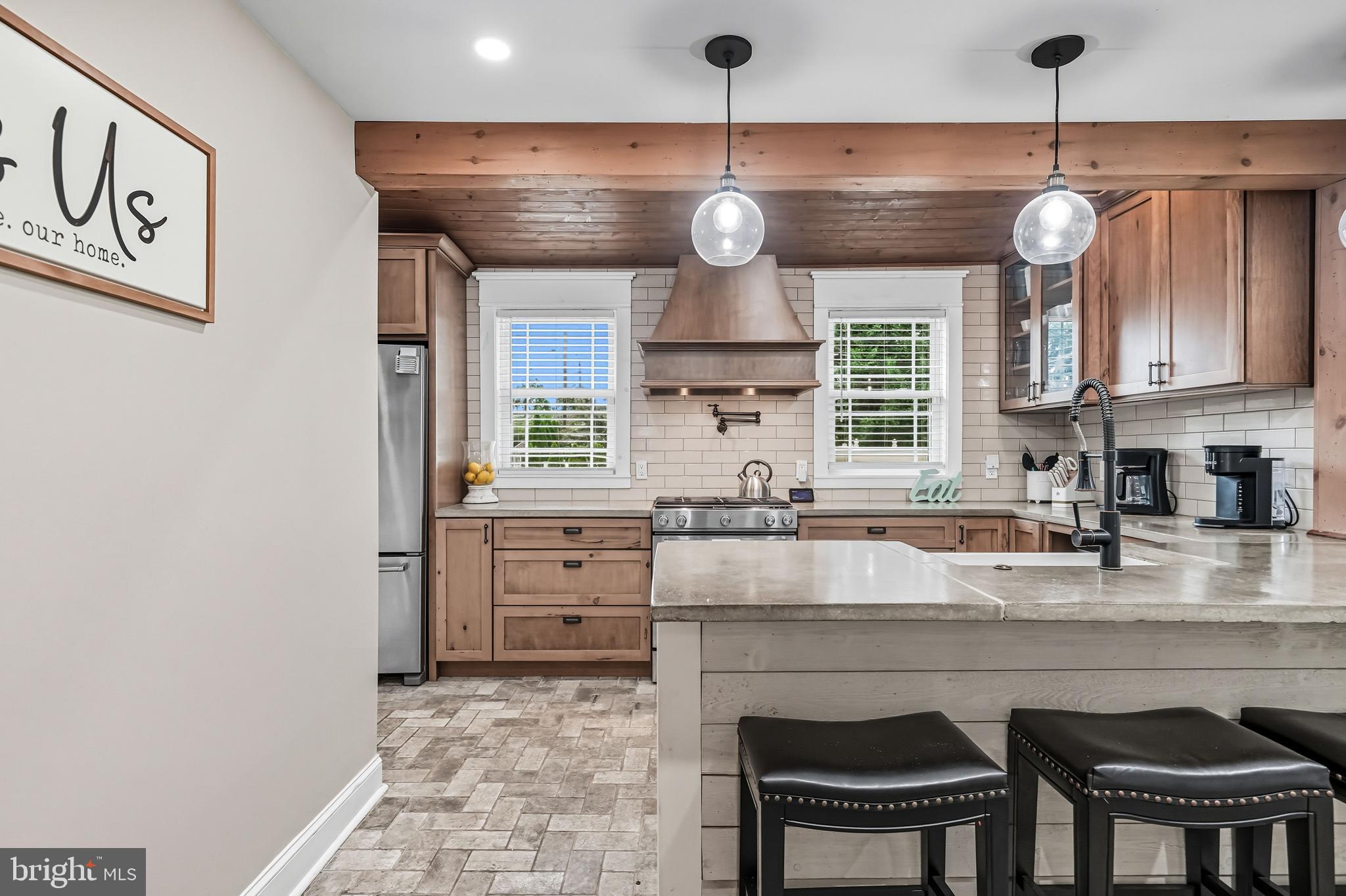 1600 West High Street Haddon Heights, NJ 08035 - Photo 22 of 46 a kitchen with granite countertop a stove a sink and a refrigerator