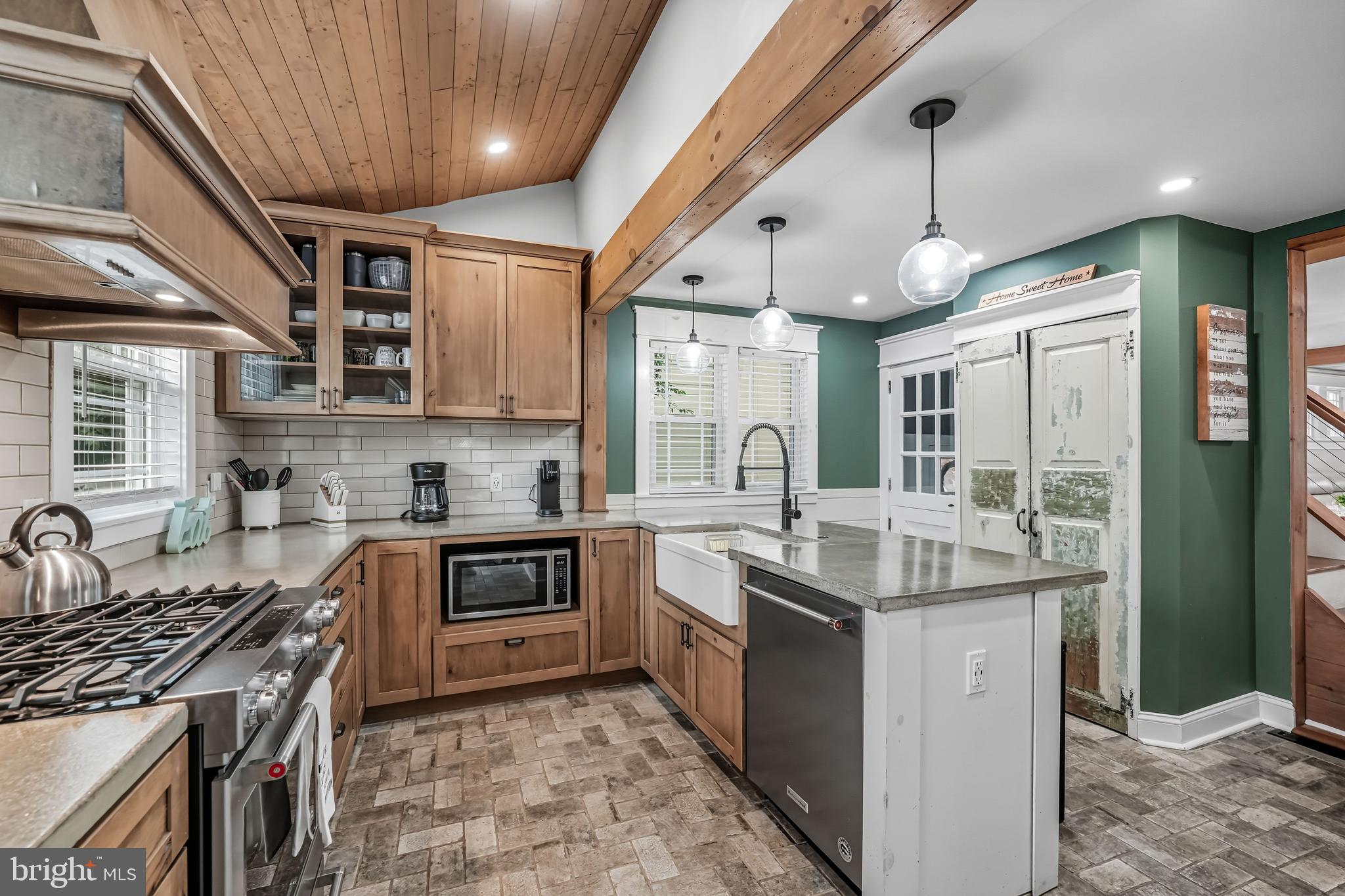 1600 West High Street Haddon Heights, NJ 08035 - Photo 26 of 46 a kitchen with stainless steel appliances granite countertop a sink stove and cabinets