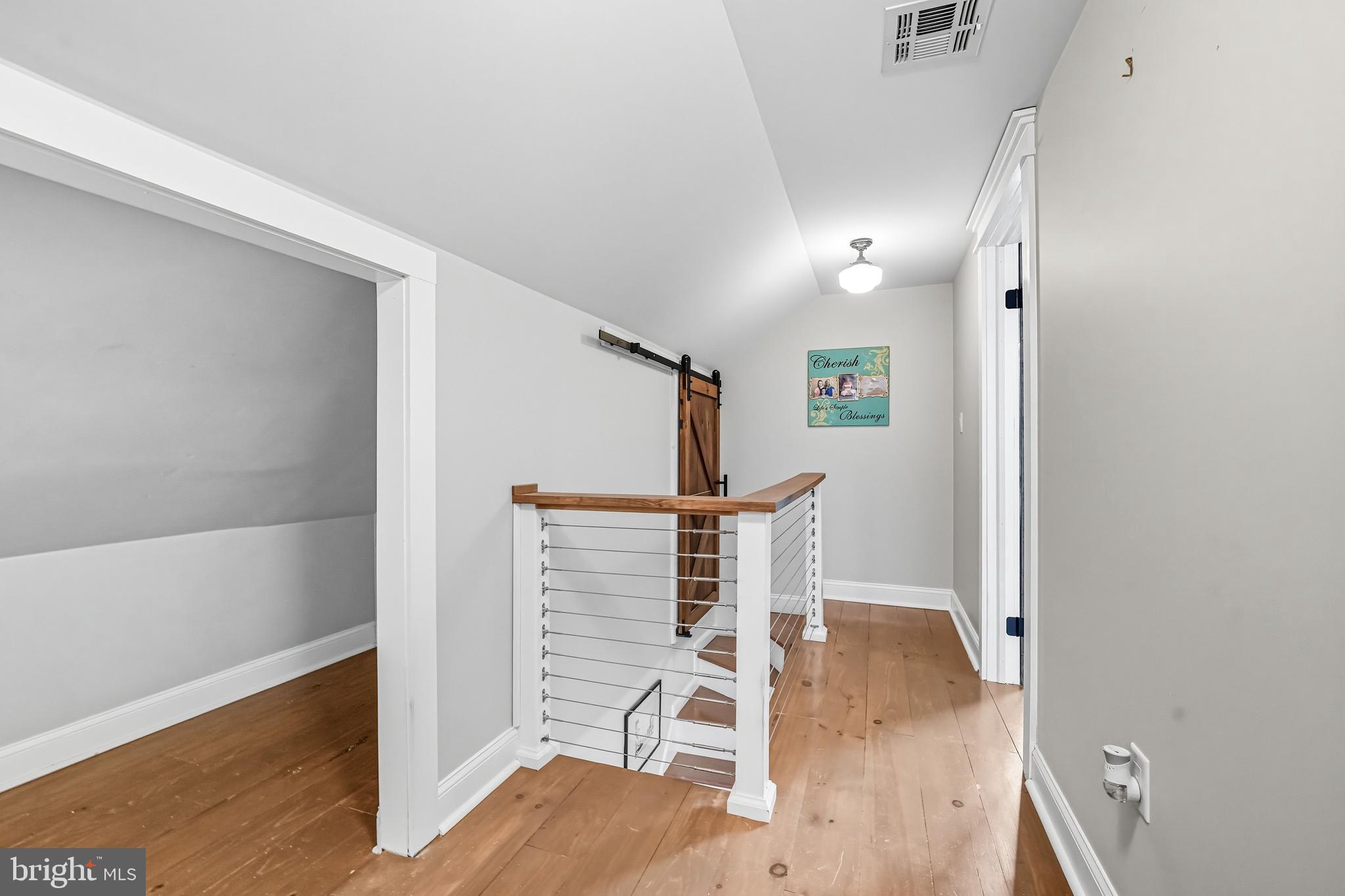 1600 West High Street Haddon Heights, NJ 08035 - Photo 31 of 46 a view of an empty room with wooden floor and a window