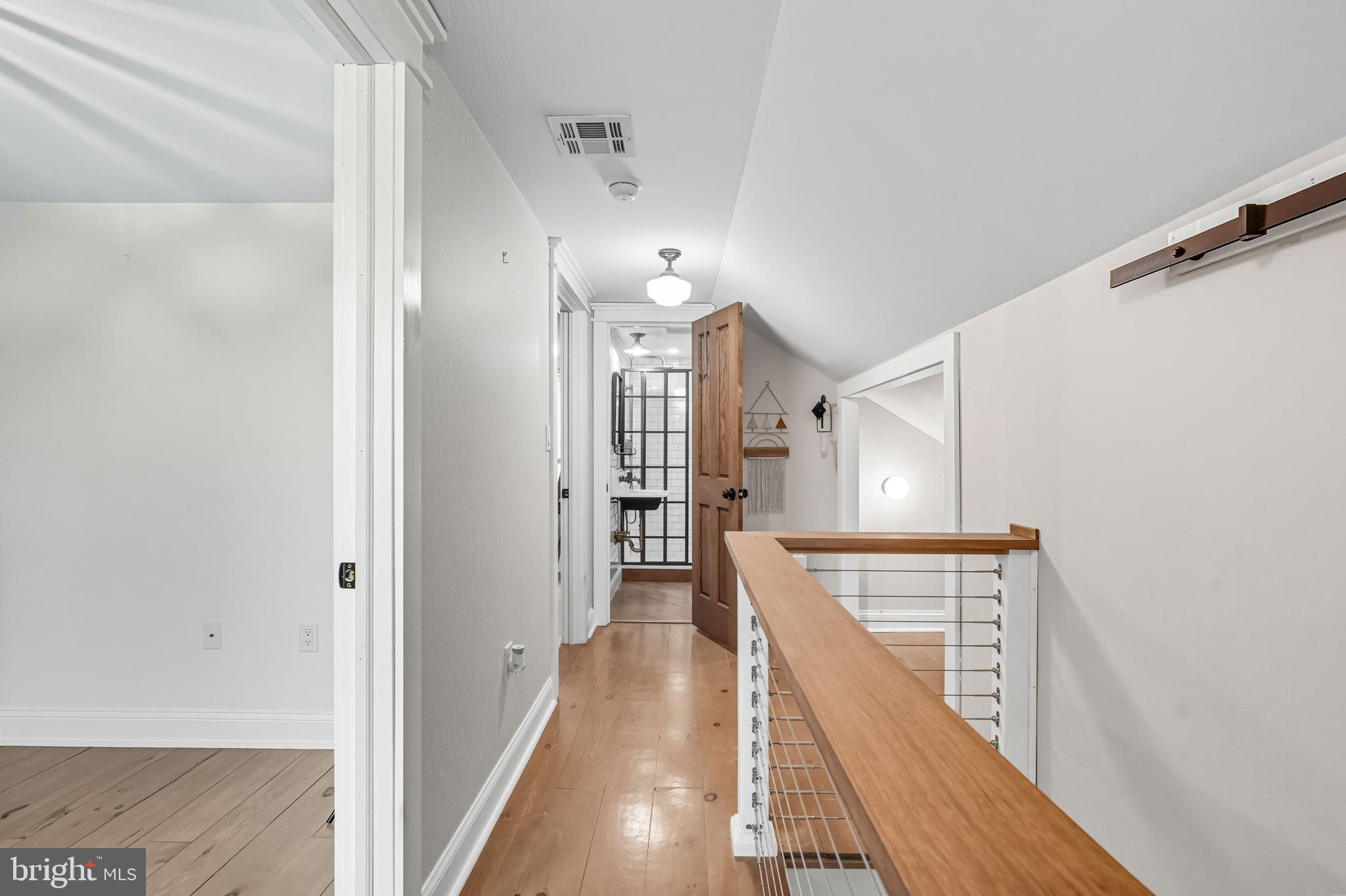 1600 West High Street Haddon Heights, NJ 08035 - Photo 32 of 46 a view of a hallway with wooden floor and staircase
