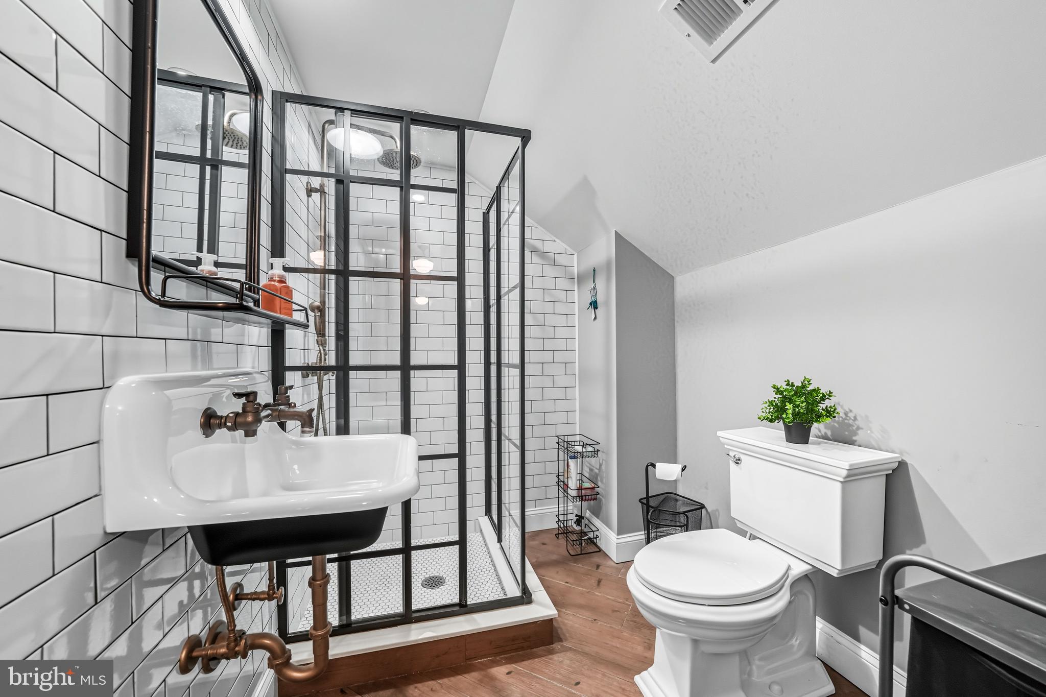 1600 West High Street Haddon Heights, NJ 08035 - Photo 36 of 46 a bathroom with a sink mirror and toilet