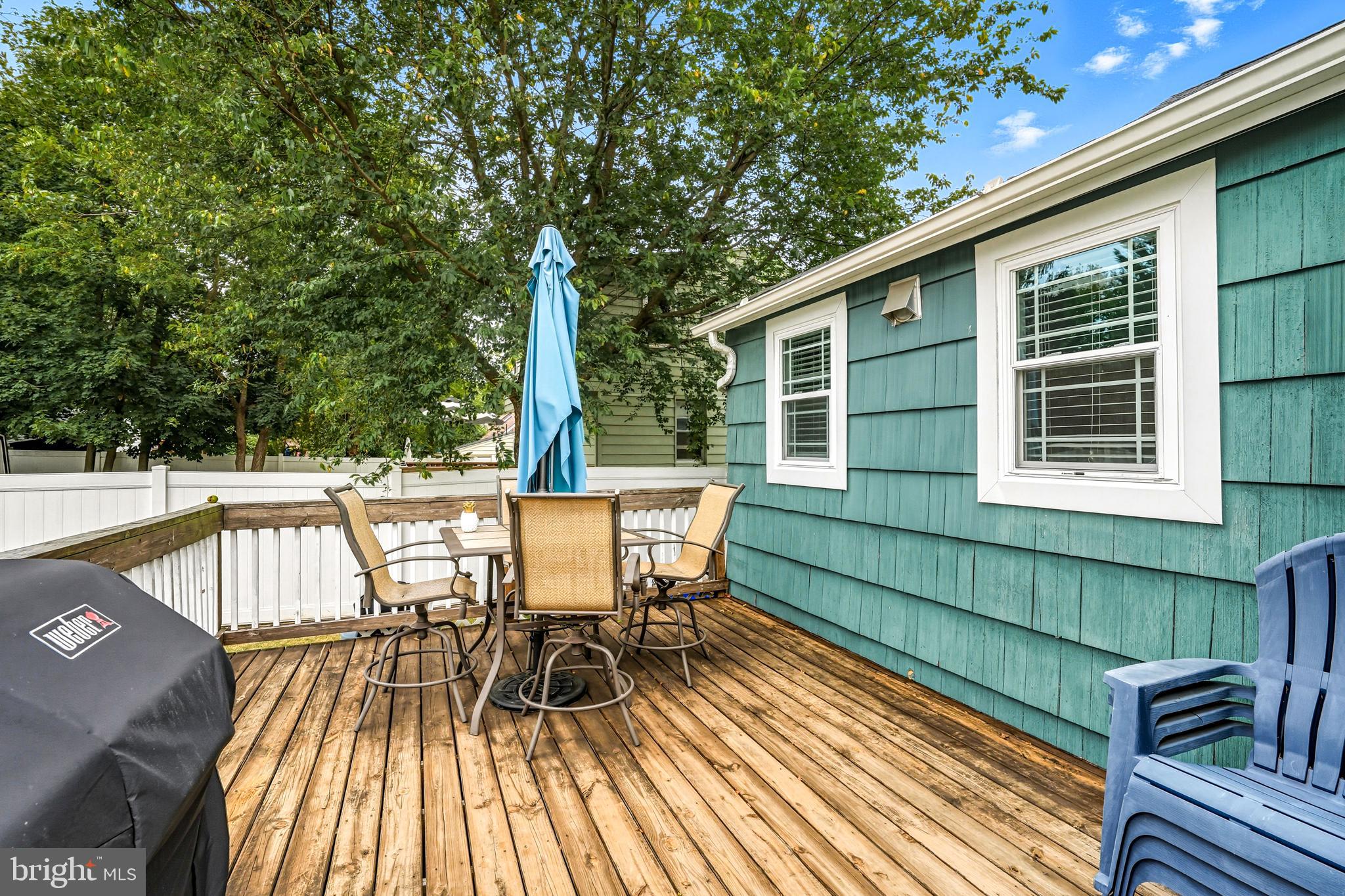 1600 West High Street Haddon Heights, NJ 08035 - Photo 45 of 46 a view of a chairs and table on the wooden deck