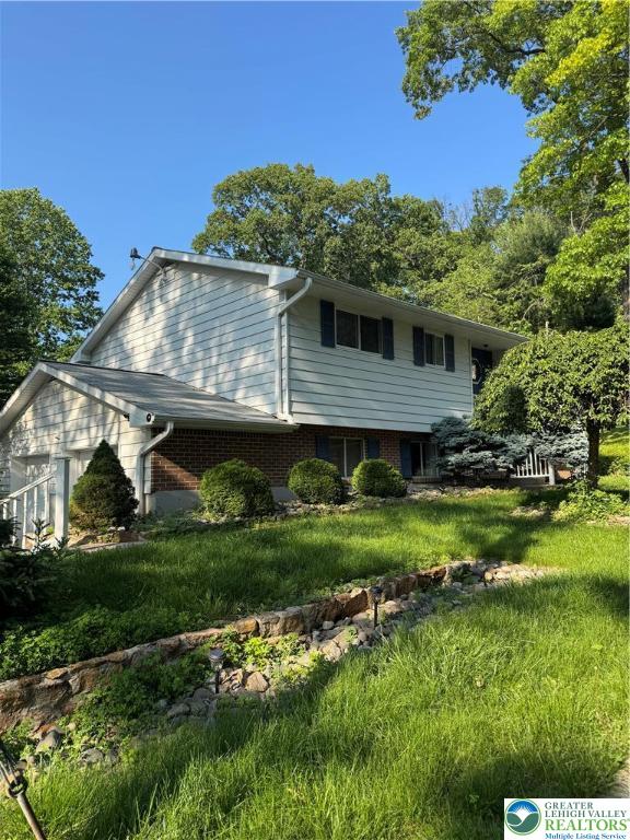 2707 Broder Street Southwest Allentown, PA 18103 - Photo 2 of 27 a front view of a house with a yard