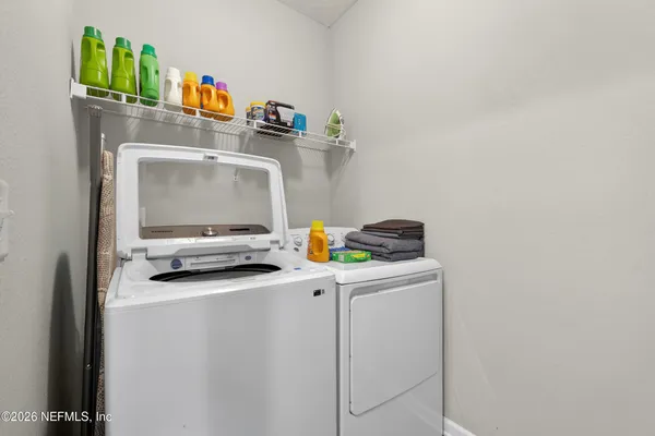 a utility room with dryer and washer