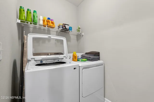 a utility room with dryer and washer