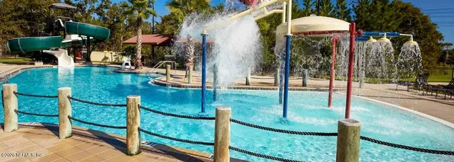 a view of a swimming pool with a patio