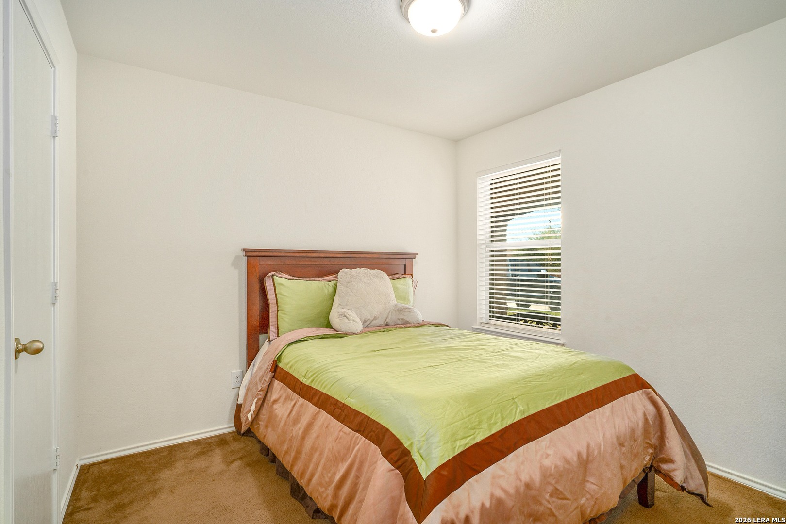 2306 Howry Drive Georgetown, TX 78626 - Photo 11 of 15 a bedroom with a bed and a window
