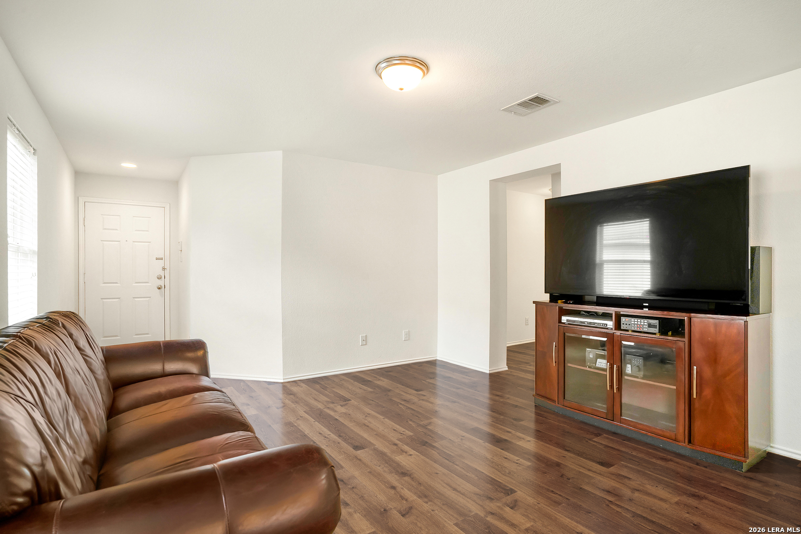 2306 Howry Drive Georgetown, TX 78626 - Photo 4 of 15 a living room with furniture and a flat screen tv
