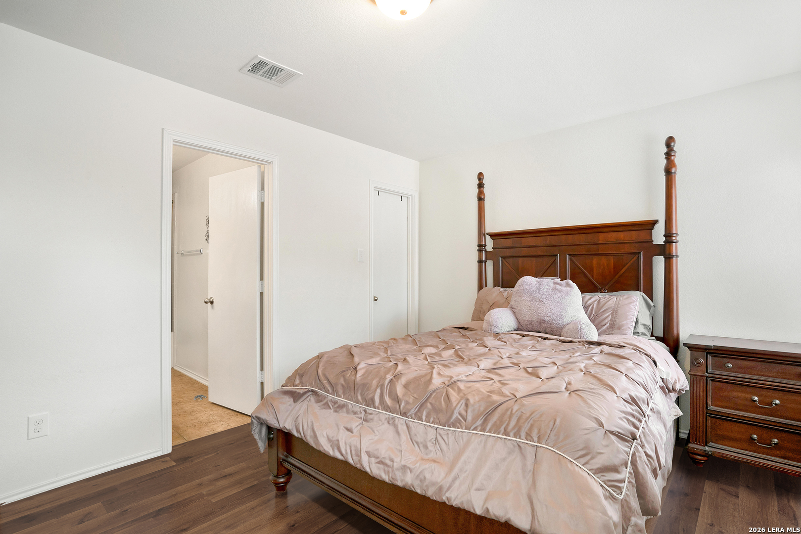 2306 Howry Drive Georgetown, TX 78626 - Photo 8 of 15 a bedroom with a bed and wooden floor