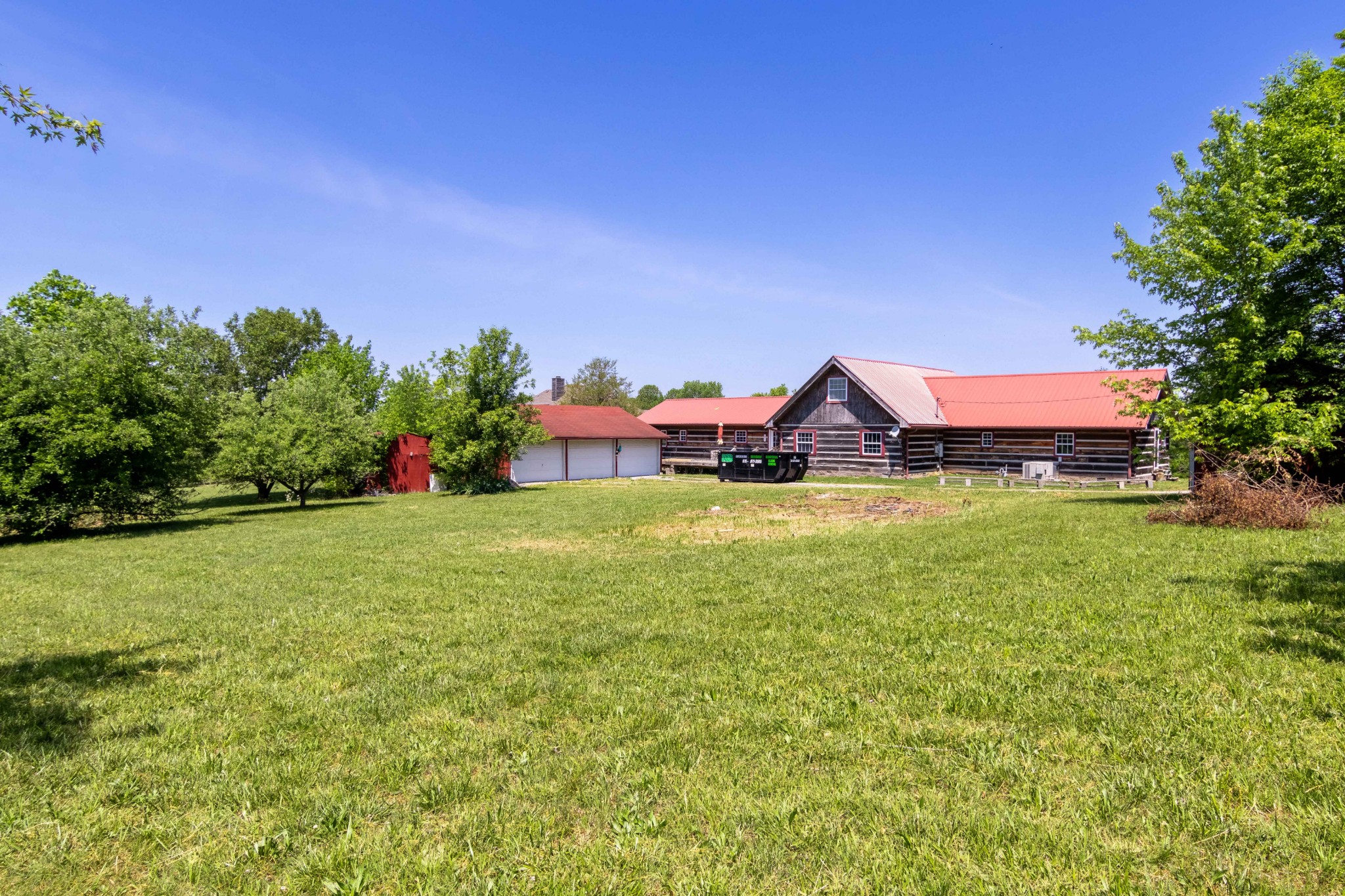 6323 Bethlehem Road Springfield, TN 37172 - Photo 7 of 30 a view of a house with a big yard and potted plants