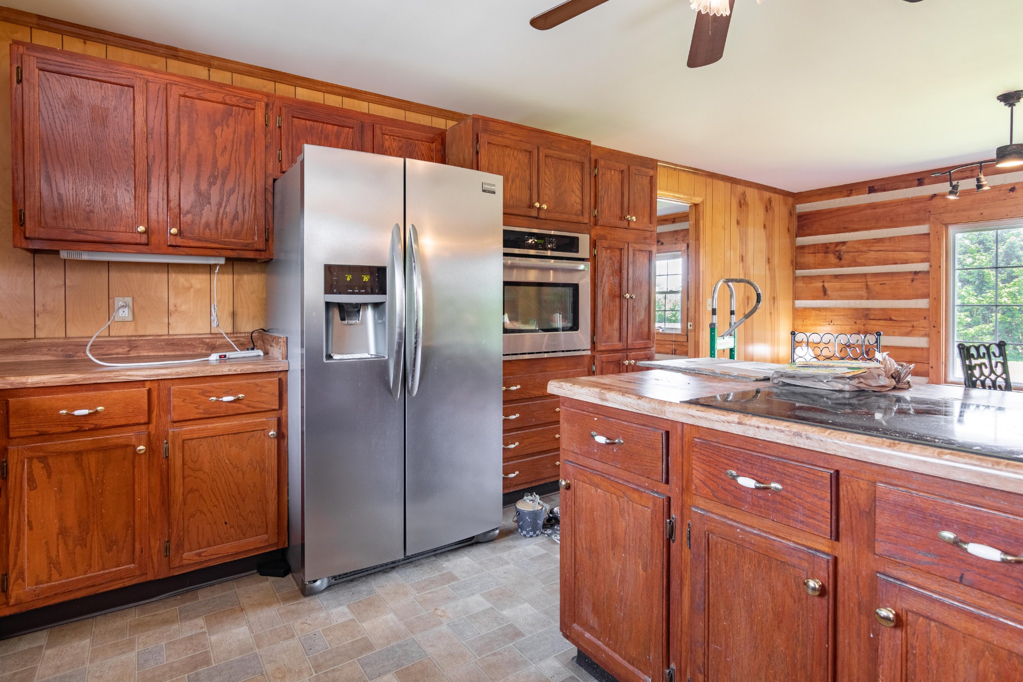 6323 Bethlehem Road Springfield, TN 37172 - Photo 9 of 30 a kitchen with stainless steel appliances granite countertop a refrigerator sink and cabinets