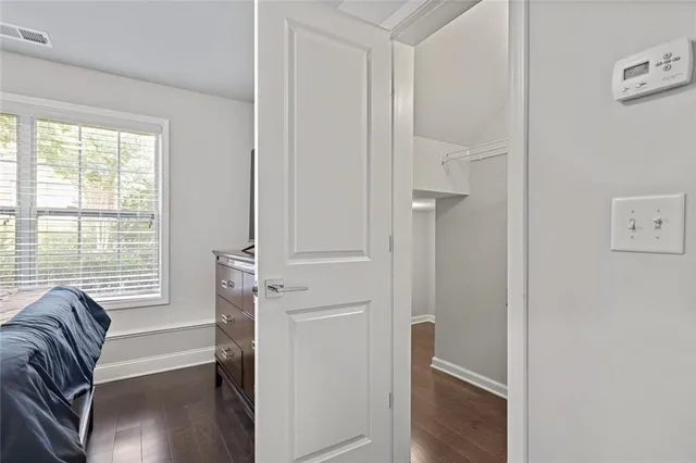 a view of a livingroom with a large window and couch