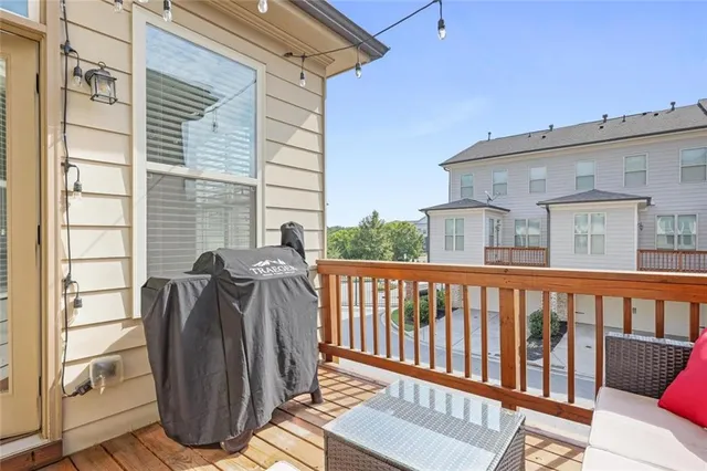 a view of a two chairs in the balcony