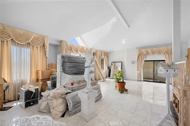 a living room with furniture and a lamp