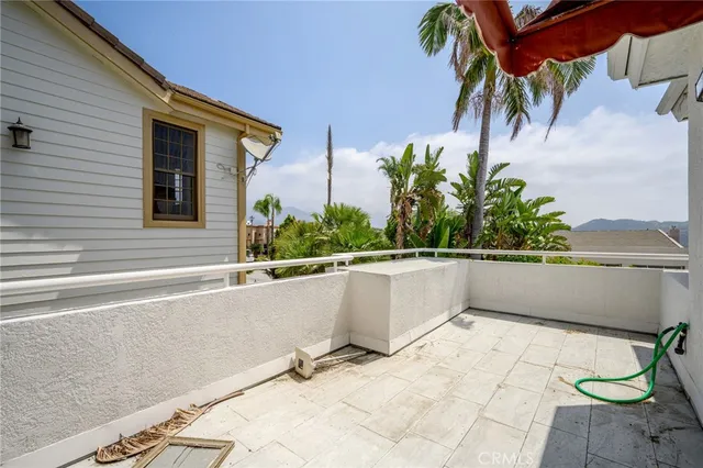 a view of balcony with furniture