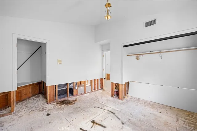 a bathroom with a granite countertop sink mirror and shower
