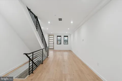 an entryway in a hall with a window