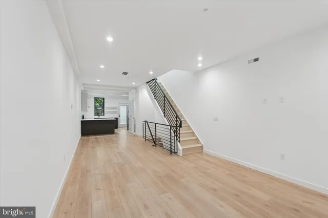 a view of entryway with wooden floor