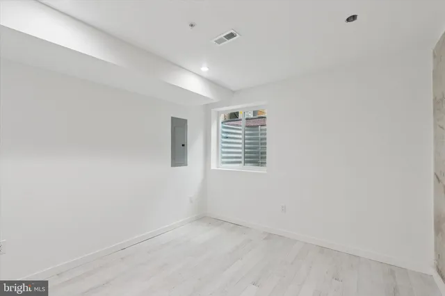 a view of an empty room with a window