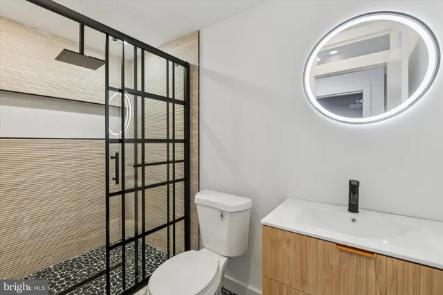 a bathroom with a toilet and a sink