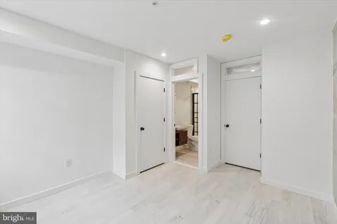 a bathroom with a shower and a sink