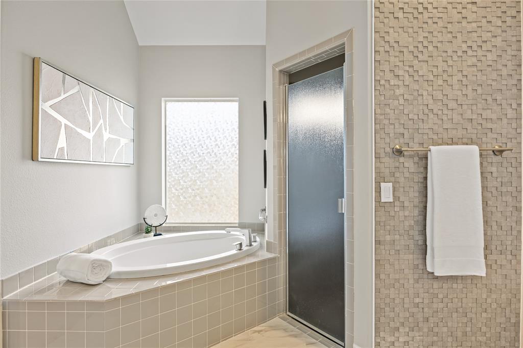 10409 Countryside Drive Denton, TX 76207 - Photo 28 of 38 Full bathroom with a bath, a stall shower, and marble finish flooring