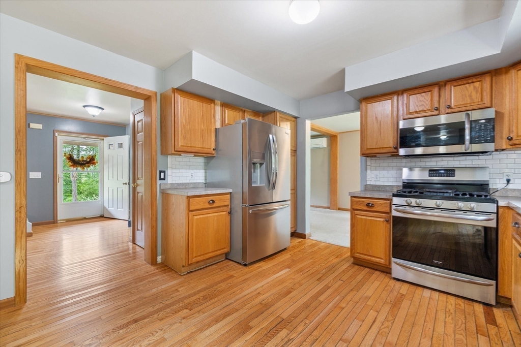 1824 Greenwich Road Hardwick, MA 01082 - Photo 11 of 41 a kitchen with stainless steel appliances a stove top oven a sink and a refrigerator
