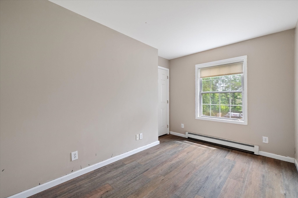 1824 Greenwich Road Hardwick, MA 01082 - Photo 24 of 41 an empty room with wooden floor and windows