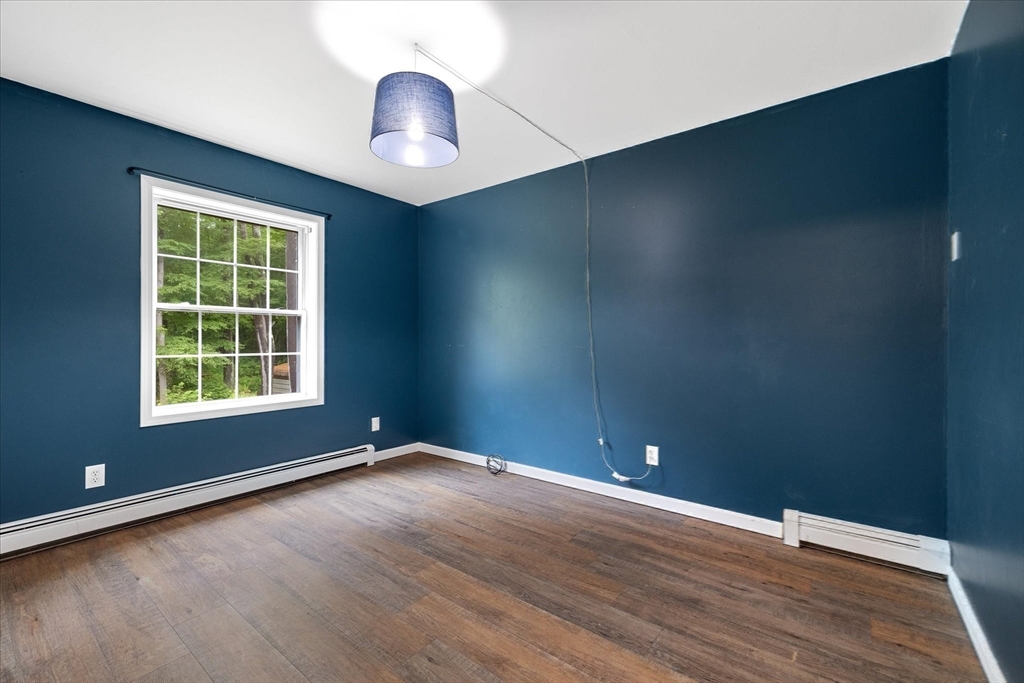 1824 Greenwich Road Hardwick, MA 01082 - Photo 26 of 41 an empty room with wooden floor and windows
